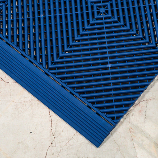 Looking down on connecting Swisstrax Ribtrax Pro Royal Blue tiles and ramps