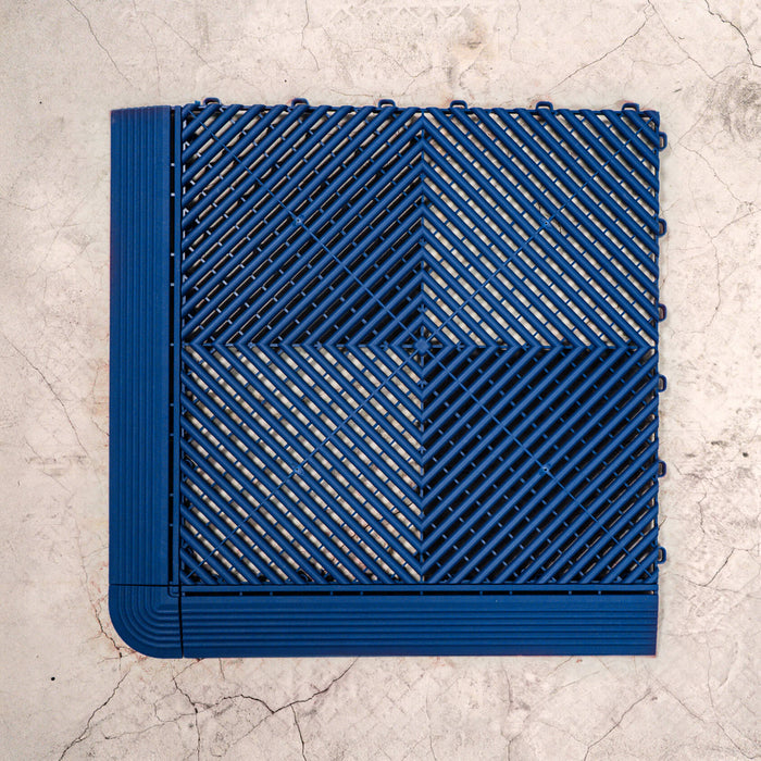 Swisstrax Ribtrax Pro Royal Blue Tile with ramps and a corner attached