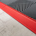 A closeup of a Racing Red ramp section and a Slate Grey tile